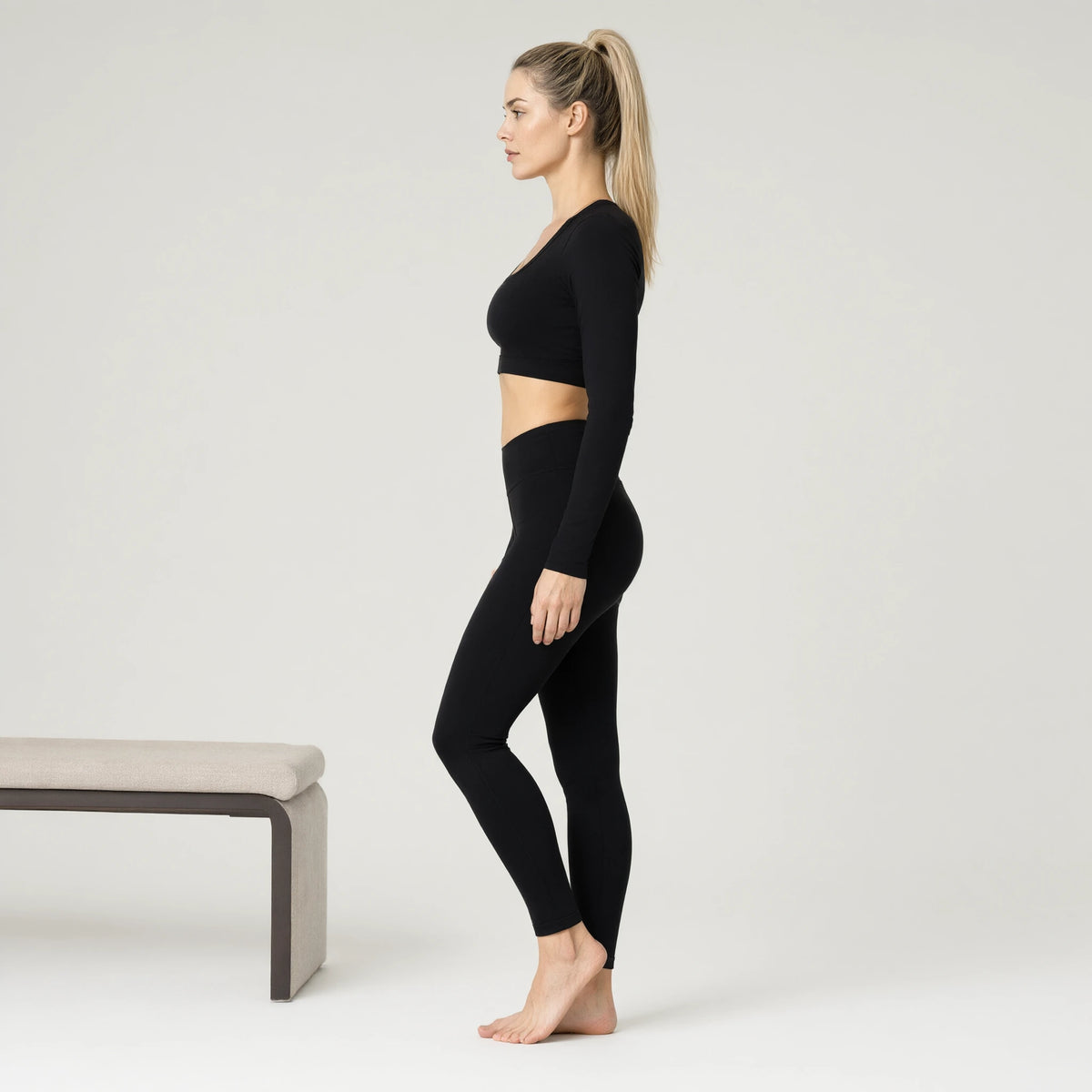 Black | Long Sleeve Yoga Wear Outdoor Sports Top｜DUVETMOON – side view (ankles gently crossed)