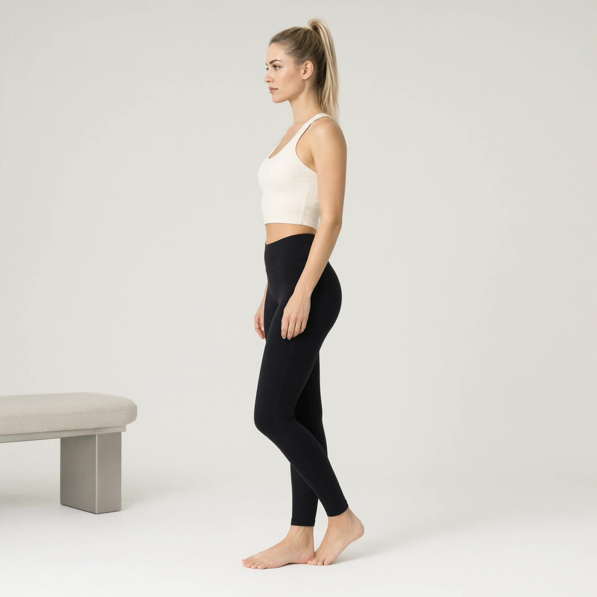 Light Ivory | Ribbed Yoga Casual Tank Top｜DUVETMOON – side view (ankles gently crossed)