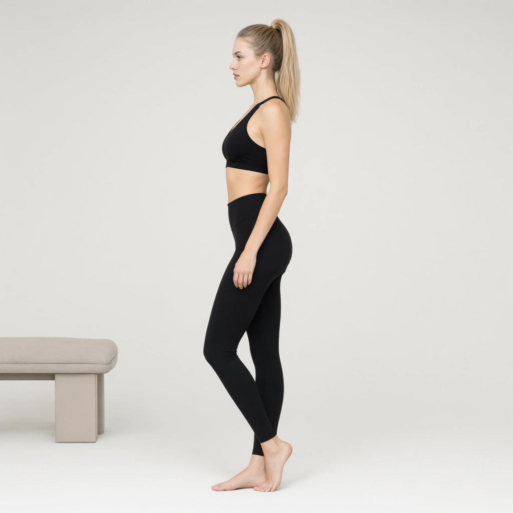Padded Black Bra | Personality Sports Seamless Bra｜DUVETMOON – side view (ankles gently crossed)