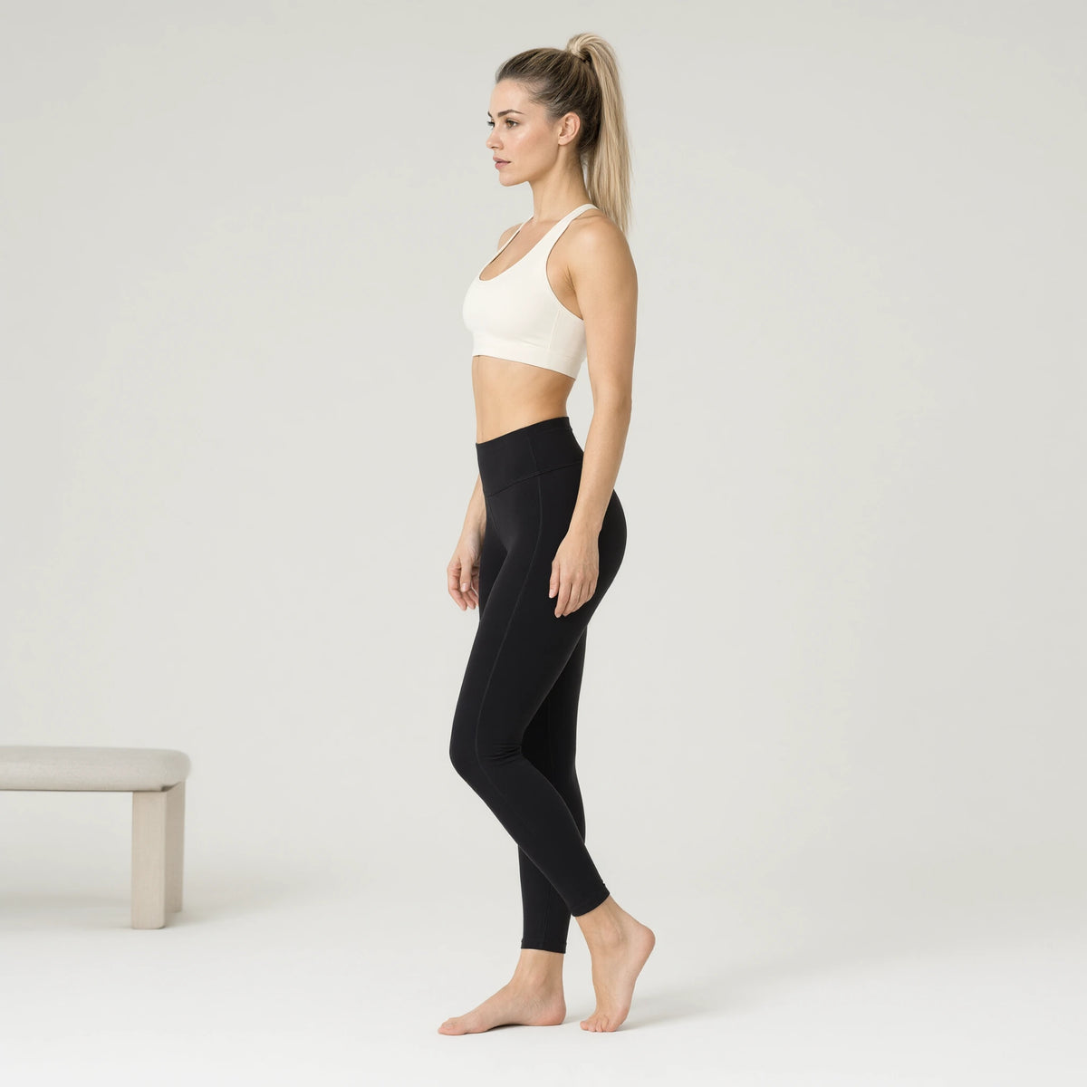 Ivory | 1pc Strap Sport Bras Padded Strappy Crop Square｜DUVETMOON – side view (ankles gently crossed)