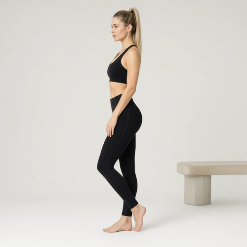 Black | 3-Piece Seamless Yoga Set for Women｜DUVETMOON – side view (ankles gently crossed)