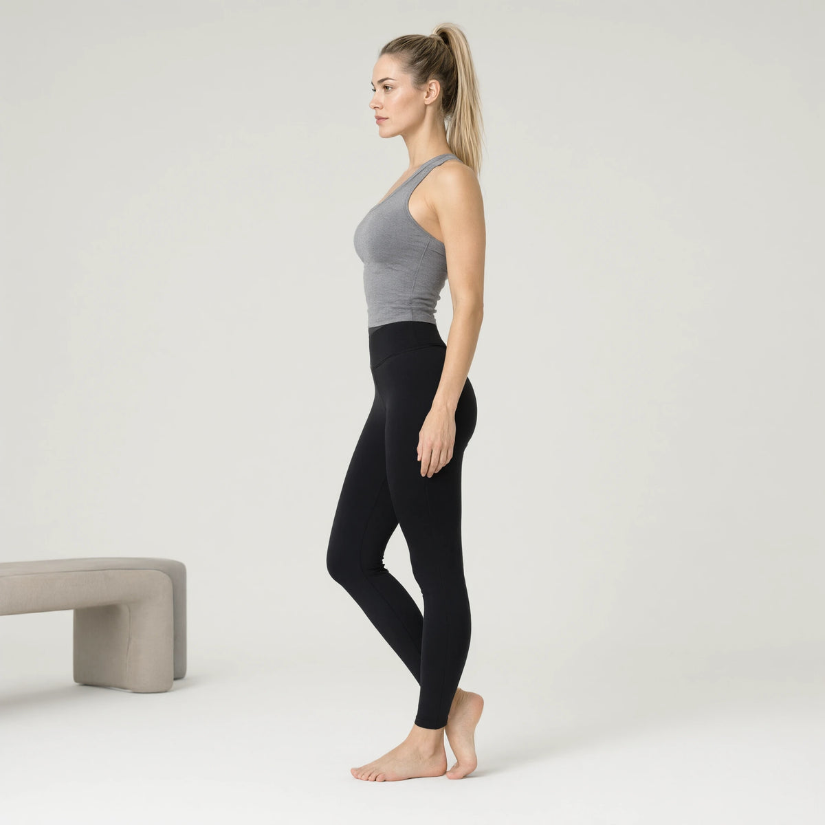 Gray | Backless Yoga Tank Top Shirts Sleeveless Off Shoulder｜DUVETMOON – side view (ankles gently crossed)
