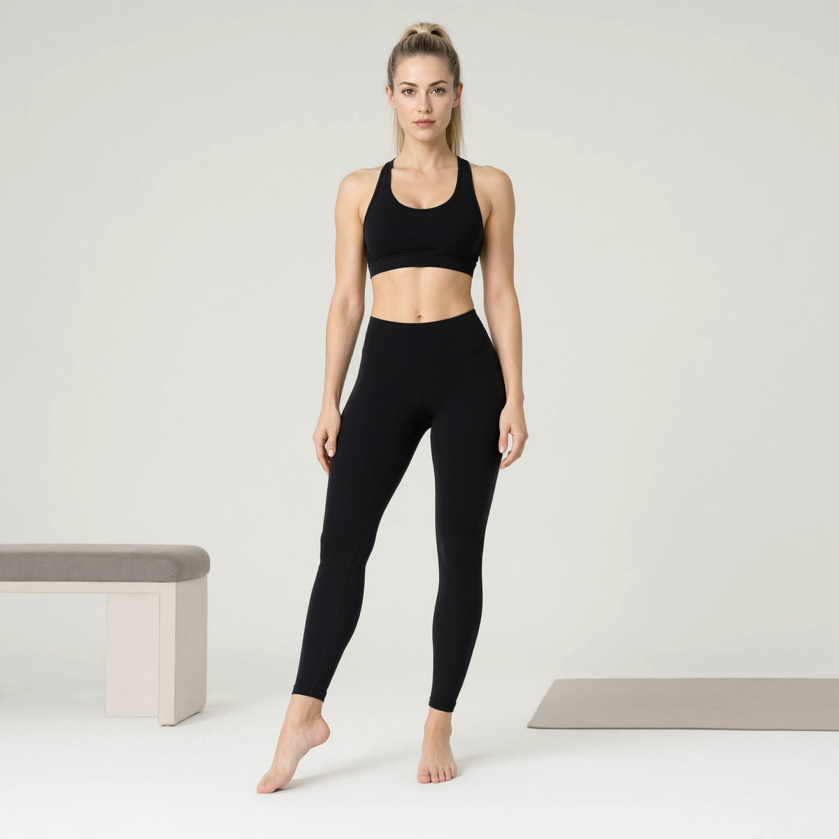 Mysterious Black | Lightweight Seamless Sports Bra｜DUVETMOON – front view (one foot stepped half a pace forward)