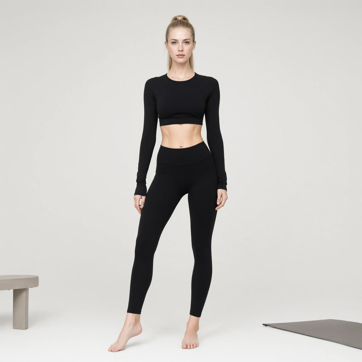 Black | Long Sleeve Sports Running Crop Top｜DUVETMOON – front view (one foot stepped half a pace forward)