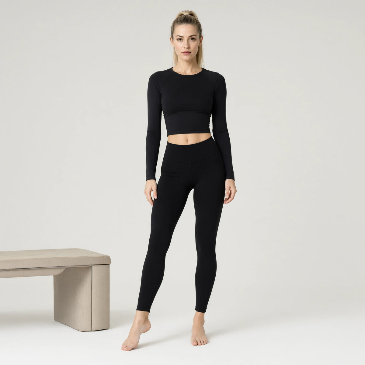 Black | Long Sleeve Yoga Top｜DUVETMOON – front view (one foot stepped half a pace forward)
