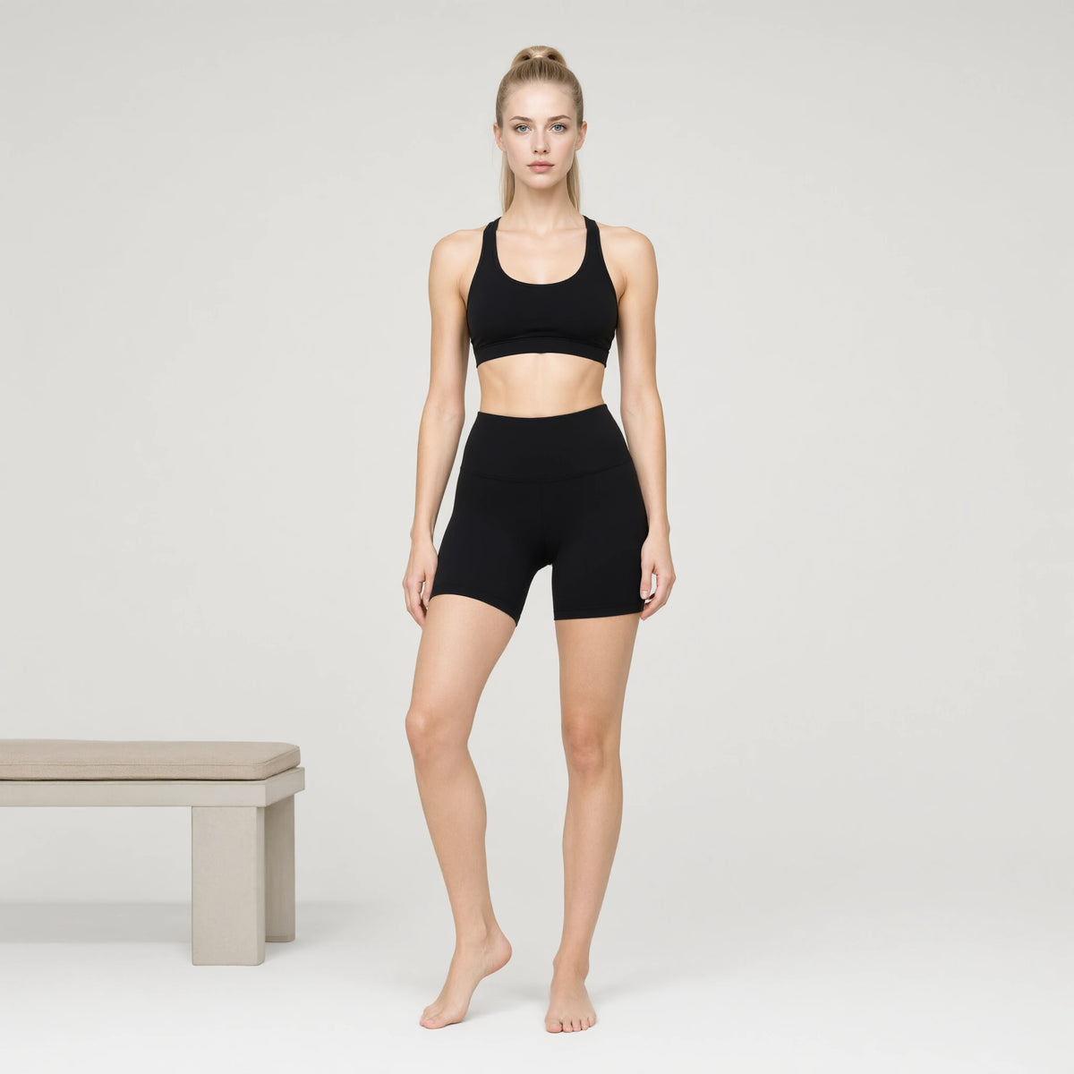 Black | 2 Piece Workout Sets High Waisted Shorts Tummy｜DUVETMOON – front view (one foot stepped half a pace forward)