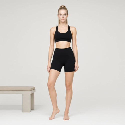 Black | 2 Piece Workout Sets High Waisted Shorts Tummy｜DUVETMOON – front view (one foot stepped half a pace forward)