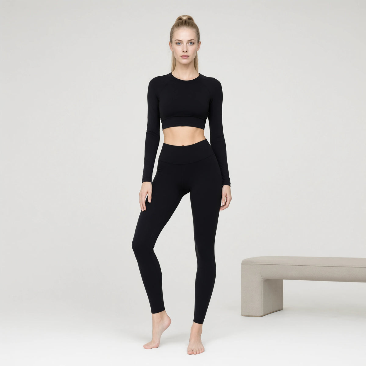 Black | Long Sleeve Yoga Wear Top｜DUVETMOON – front view (one foot stepped half a pace forward)