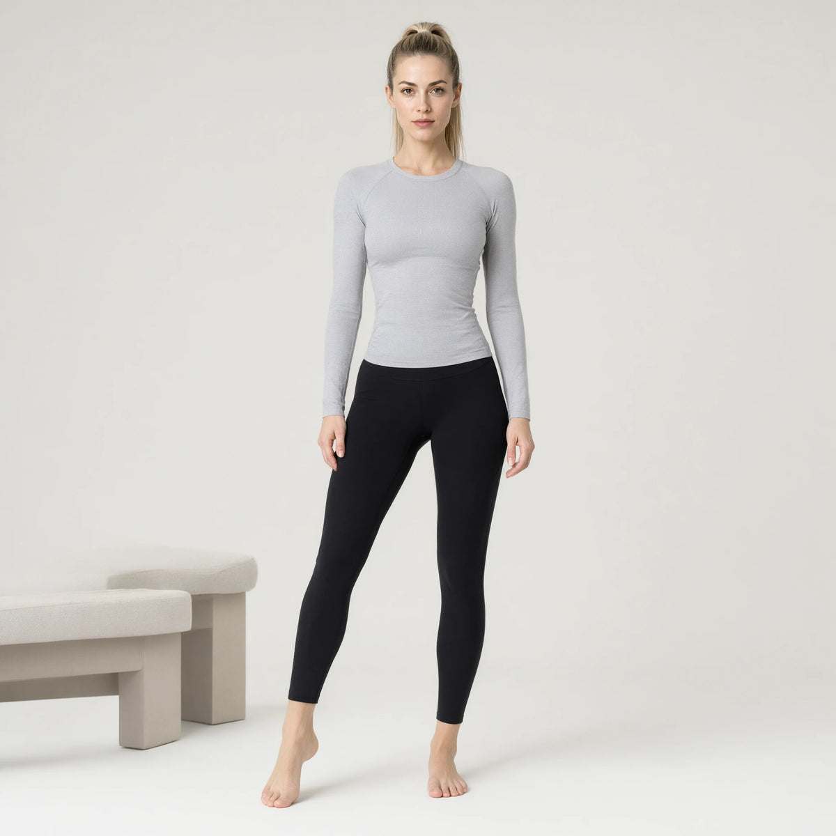 Light Grey | Running Yoga Navel Seamless Long Sleeve Top｜DUVETMOON – front view (one foot stepped half a pace forward)