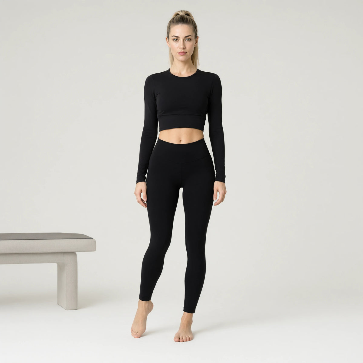 Black | Comfortable Nude Yoga Top Long Sleeve｜DUVETMOON – front view (one foot stepped half a pace forward)
