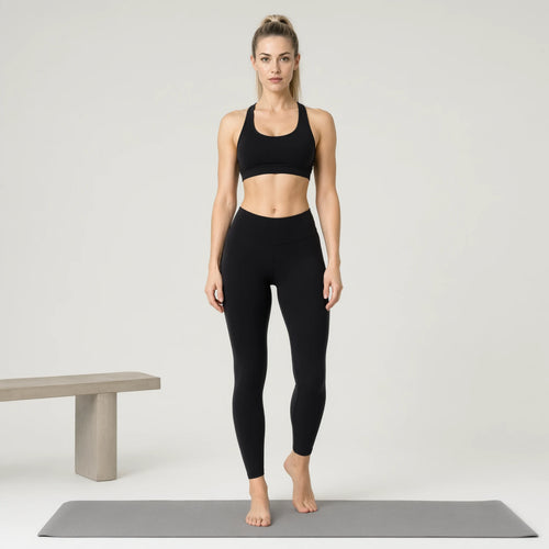 Black | 2-Piece Quick-Dry Bra & Leggings Set for Women｜DUVETMOON – front view (one foot stepped half a pace forward)