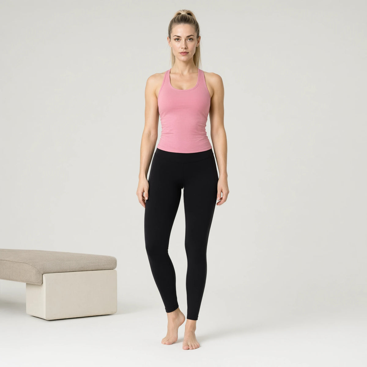 Pink | Fisoew Workout Tank Tops Sleeveless Scoop Neck Racerback｜DUVETMOON – front view (one foot stepped half a pace forward)