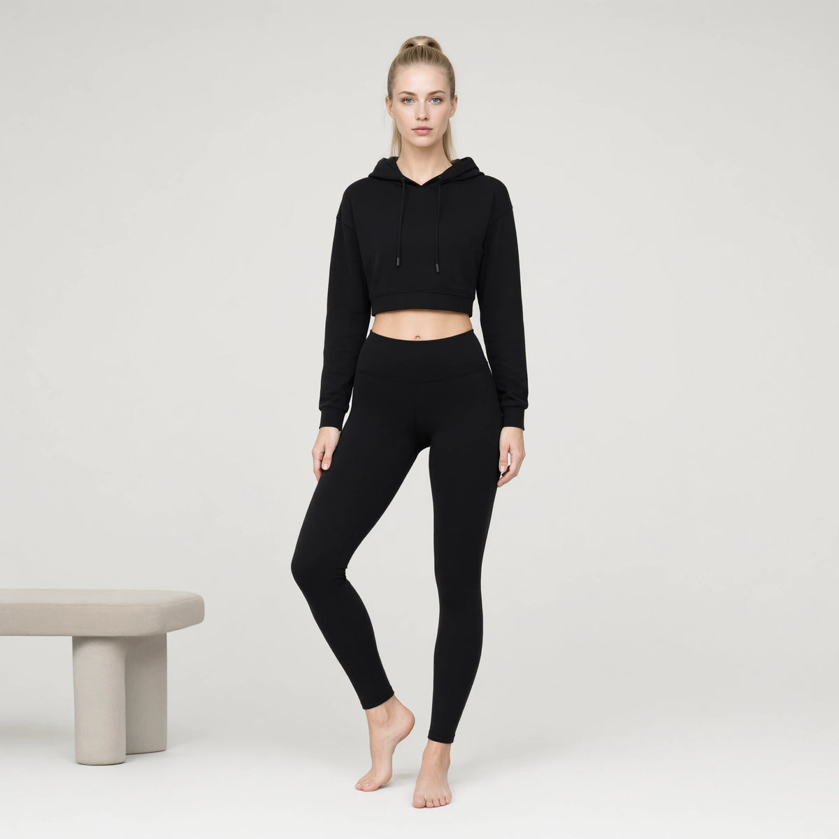 Black | Crop-top Yoga Workout Short Hoodie｜DUVETMOON – front view (one foot stepped half a pace forward)