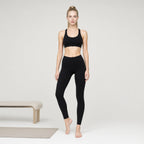 Padded Black Bra | Personality Sports Seamless Bra｜DUVETMOON – front view (one foot stepped half a pace forward)