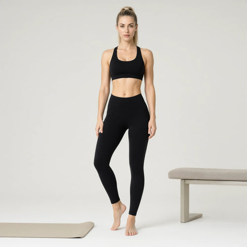 Black | 3-Piece Seamless Yoga Set for Women｜DUVETMOON – front view (one foot stepped half a pace forward)