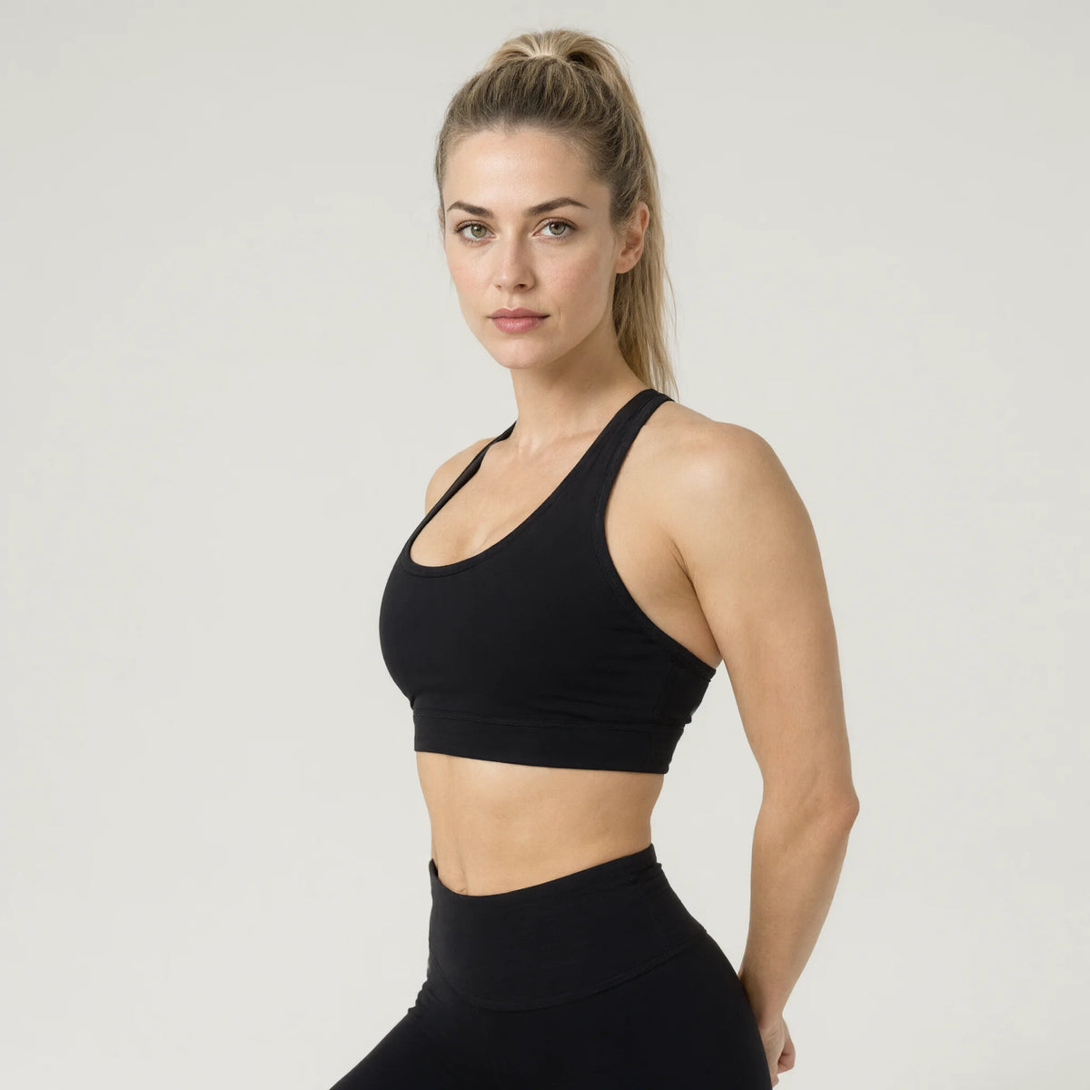 Black | Leopard Print Workout Sets 2 Piece Outfits Crop｜DUVETMOON – detail close-up (hands clasped behind the back)